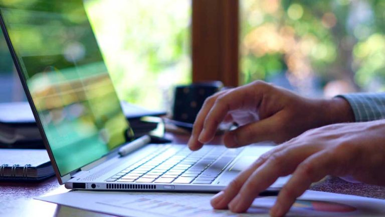person typing on Laptop